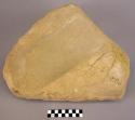 Fine grained yellow sandstone metate