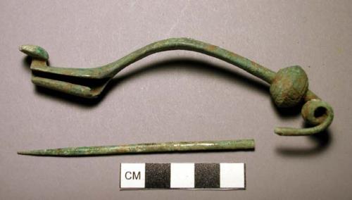 Certosa fibula, large, knob above spring incised