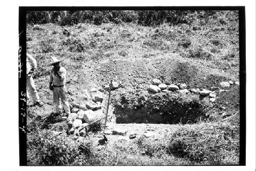 Workers next to test pit 3-39