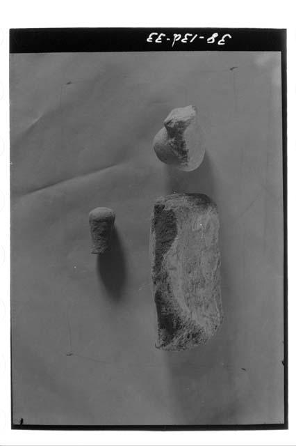 Upper row, thick orange ware sherd and brown ware solid leg. Lower row, brown wa