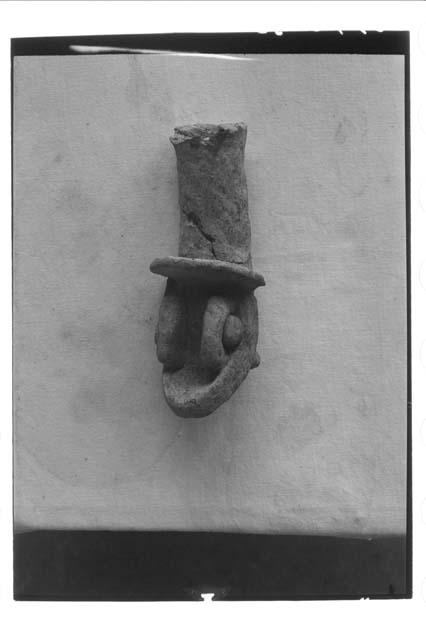 Serpent head incensario handle from above floor of temple 22.