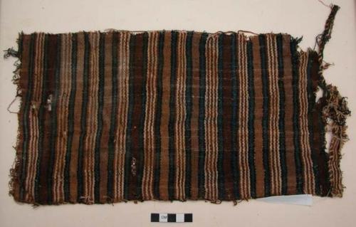 Organic, woven fiber, textile fragment, brown, blue, red striped