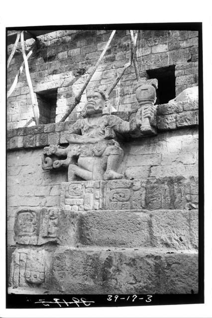 Figure on west end of temple reviewing stand