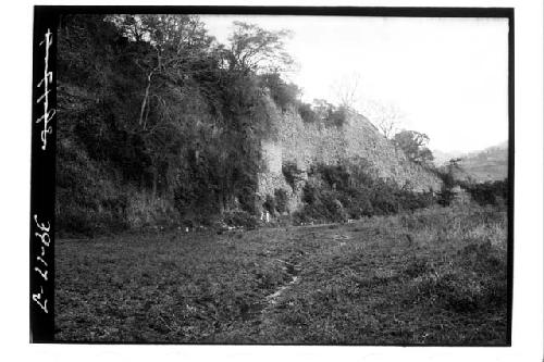 Men standing on test pit 5-39 at river front