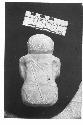 Carved green stone squatting human figurine with bow and arrow on back