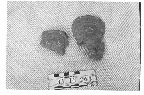 Two fragmentary pottery figurine heads