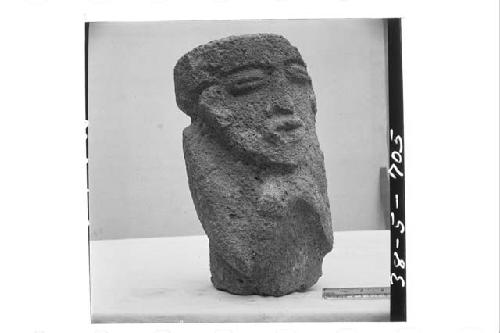 Front and right side of stone figure