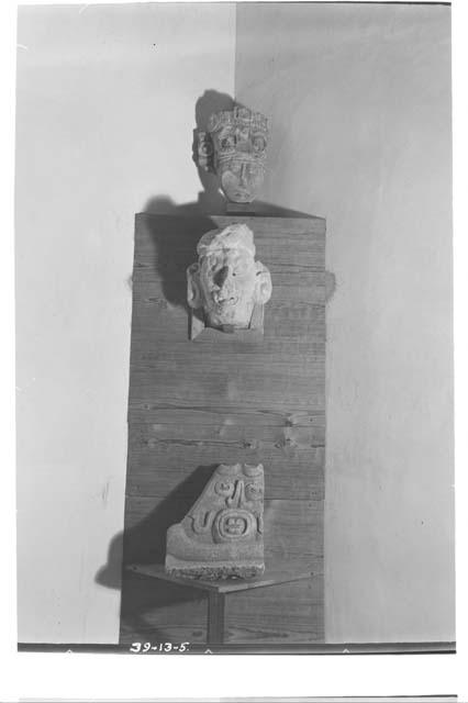 Panel exhibiting heads and Ahau face in northeast corner