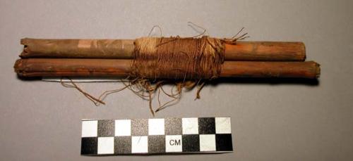 Wrapped sticks and yarns, a) l. 18 cm. 1.2 cm, 2 sections of cane wrapped togeth