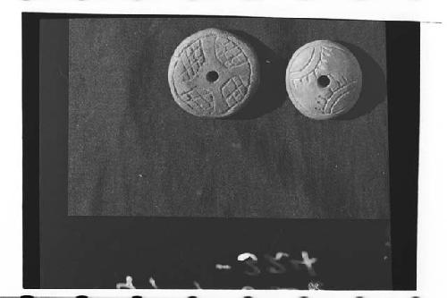 Spindle-whorls with incised decoration