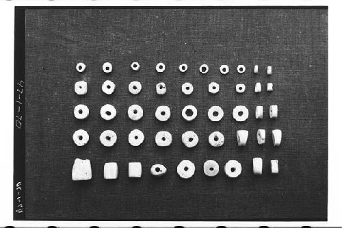 Shell beads. Nebaj, Quiche, Mound 3, Tomb II, #29.