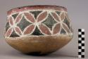 Ceramic, earthenware complete vessel, bowl, rounded base, polychrome slipped, cord-impressed design, blackened base