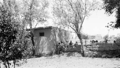 People standing near entrance to building