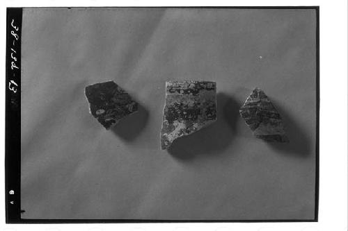 Three polychrome sherds from test pit 6-38, 1-2 meter level.