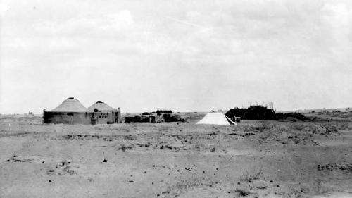 Huts and tent in desert