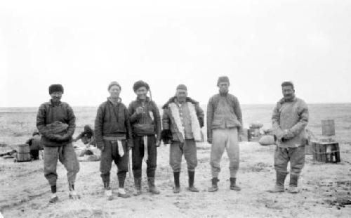 Group of people standing in desert