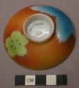Small Polychrome Ceramic Saucer with Brown Glaze and Blue and Green Leaf