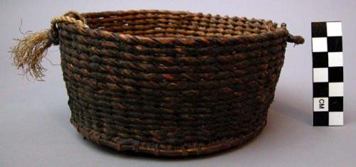 Basket, coiled and woven plant fiber, resin coated, twisted fiber cord attached