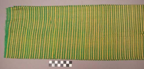 Green, yellow and white striped textile