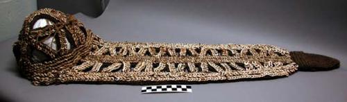 Headdress, woven fiber, decorated with cowrie shells, openwork cap and train