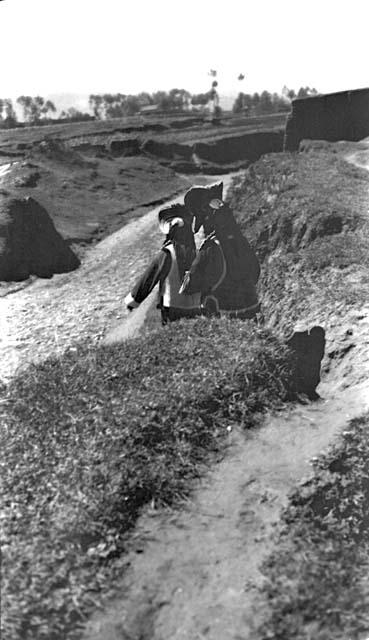 People on path along river