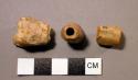 Series of beads and bone from which cut