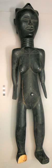 Carved female wooden figure - bits of metal inserted for teeth, standing