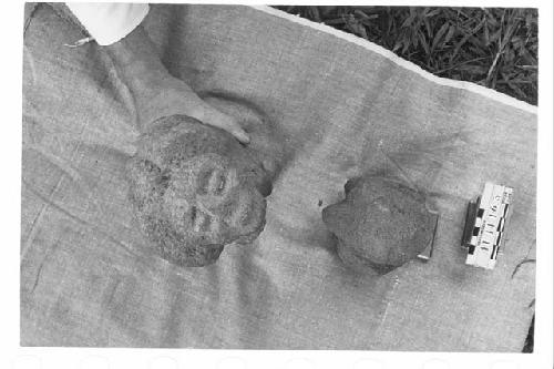 Two Carved Stone Kneeling Figures; Coarse Grey Volcanic Stone