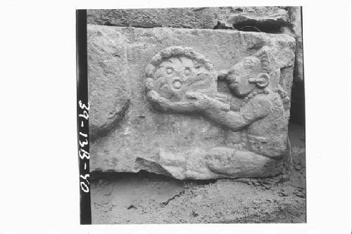Part of middle sculptured step with seated figure