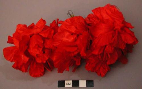 Three Red Silk Flowers on Wire Stems Twisted Together into a Tight Clump