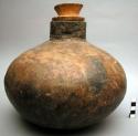 Pottery jar with wooden stopper