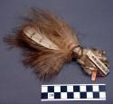 Headdress decorative element, white feathers knotted on cord, rolled into bundle