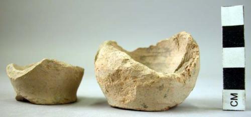 2 base potsherds - showing marks from cord used to remove from pottery wheel; pl