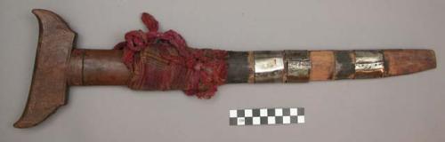 Sheath, carved wood, three silver bands, wrapped with red cloth