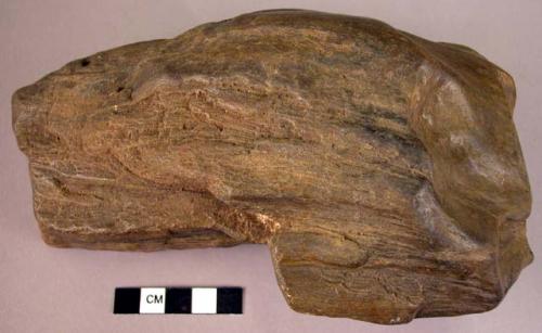 Massive single-ended hand adze of fossil wood