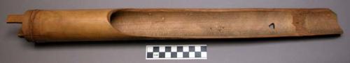 Bamboo tube, 2 rectangular feet at closed end, 2/3 halved lengthwise, perforated