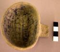 Black on white pottery ladle