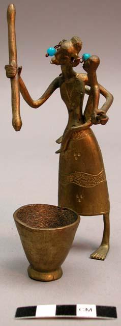 Cast brass figure of woman