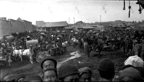 Crowd of people and carts