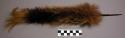 Plumes, possibly of cous-cous fur, used on top of daily headpiece