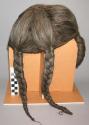 Braided wig of imitation hair, made from palm tree fibre