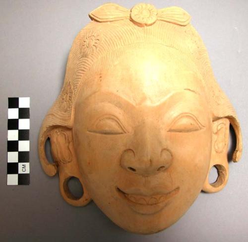 Carved wooden mask of Balinese girl - hooked curls over ears