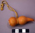 Small Natural Gourd with Yellow Silk Tassel Tied Around Its Center
