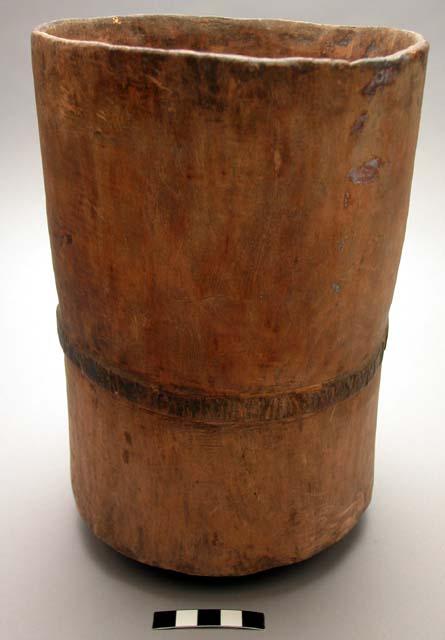 Wooden mortar; made from one piece of wood with 0.5 in. protrusion around middle