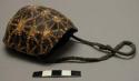 Tortoise shell on leather thong, man's medicine shell (zam) with medicine (/nun)