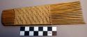 Hair comb of split bamboo with basketry top