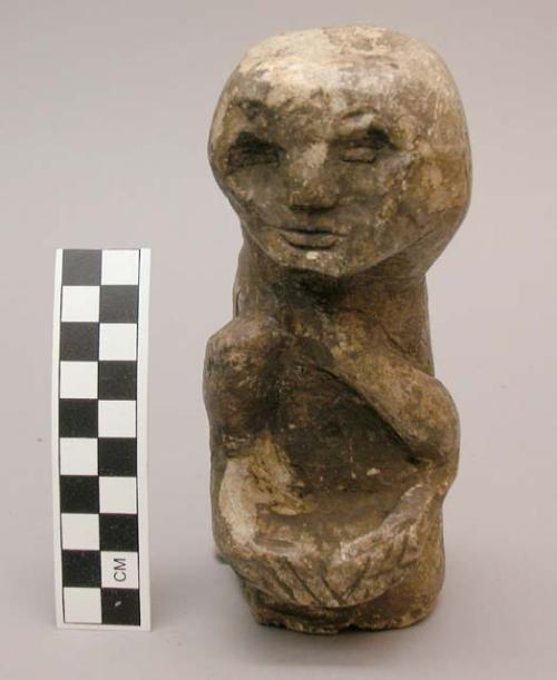 Figurine, seated human figure, hands together