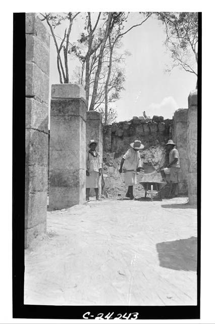 NE colonnade - showing fallen arch stones, looking N