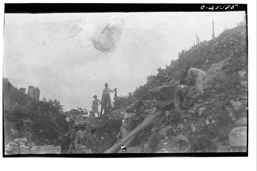 Serpent head from top Warriors stairway being returned to position