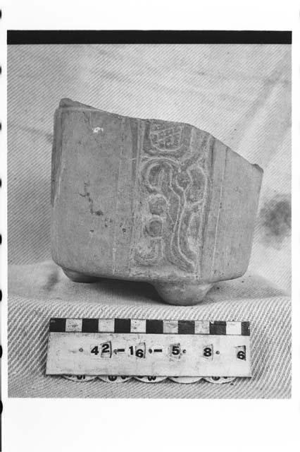 Fragmentary tripodal carved pottery vase
